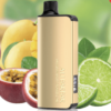 A gold Alibarbar Ingot 9000 vape device from the Bundle 5 Pcs is labeled "Passion Fruit Mango Lime" and is surrounded by tropical fruits like passion fruit, mango, and lime slices—an ideal combination of exotic flavors.